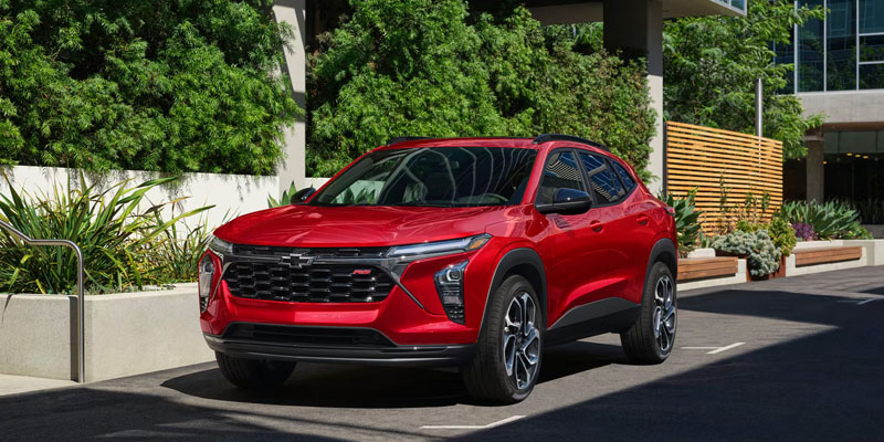 A 2026 Chevrolet Blazer parked in front of a building in Houston, TX, showcasing its sleek design and modern features.
