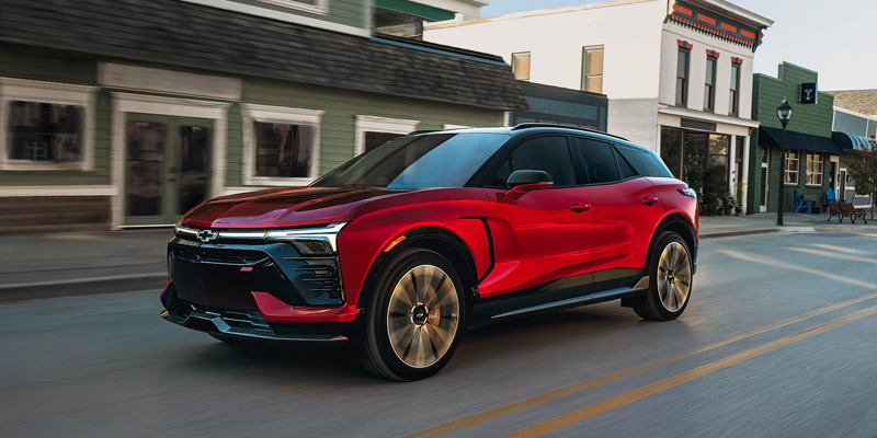 Chevrolet Blazer EV navigates a city street, highlighting its modern features against an urban backdrop.