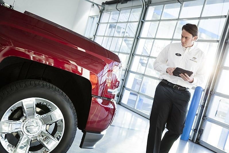 Staff inspecting vehicle